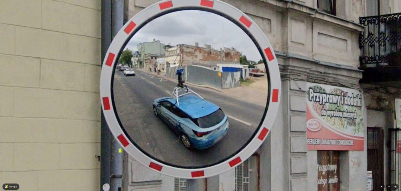 Google car in the mirror